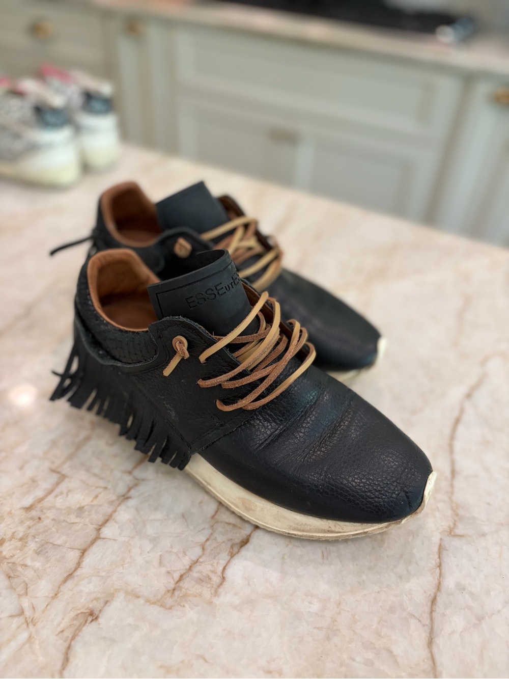 ESSENTIALS Black Leather Women’s Sneakers with Tan Laces and Fringe